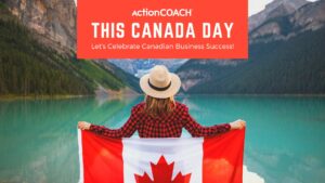 Woman Holding Canada Flag by the Lake