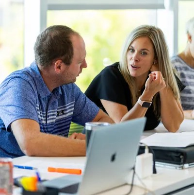 ActionCOACH coach Catherine Lavoie in a one-on-one coaching session with a business owner