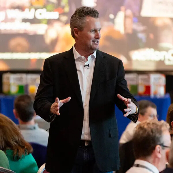 ActionCOACH founder Brad Sugars presenting to a room of business owners